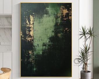 May include: Abstract art piece with a dark green and black color palette, accented with gold tones. The artwork is framed in a gold border and hangs on a white wall. The painting has a textured appearance, with visible brushstrokes.