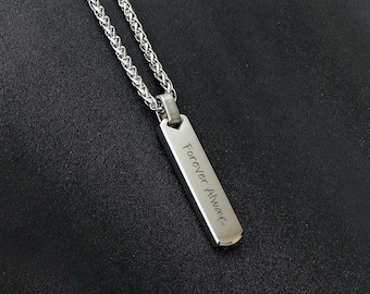 May include: A silver chain necklace with a silver rectangular pendant that says "Forever Always".