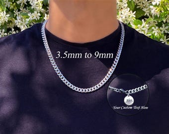 May include: Silver curb chain necklace, 3.5mm to 9mm wide, around the neck. A small, round pendant with the name "Alex" is attached. The text "Your Custom Text Here" is also visible.