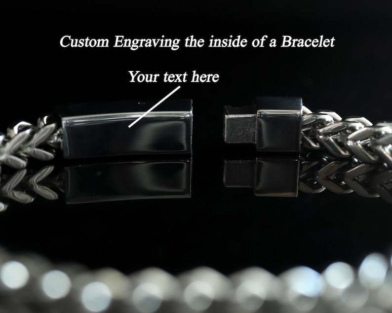May include: A silver-toned metal chain bracelet with a rectangular clasp mechanism. The image features the text Custom Engraving the inside of a Bracelet and Your text here, pointing to the smooth interior surface of the open clasp.
