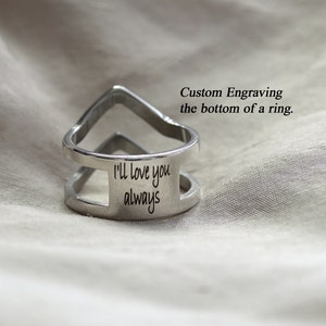 May include: A silver ring with a split band and a custom engraved message on the bottom that reads "I'll love you always".