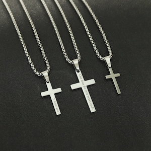 May include: Four silver chain necklaces with cross pendants. The crosses have different engravings: "I love you", "Our love for you never ends", "Alice", and "Forever".