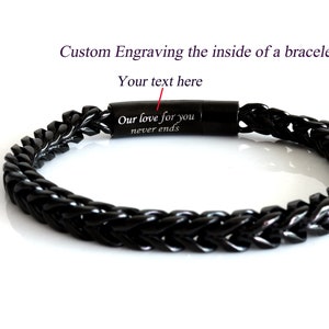 May include: Black braided bracelet with a magnetic clasp. The inside of the bracelet is engraved with the text "Our love for you never ends".