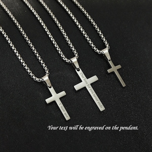 May include: Three silver chain necklaces with cross pendants. Each pendant has a different engraved message: "I love you", "Our love for you never ends", and "Alice".