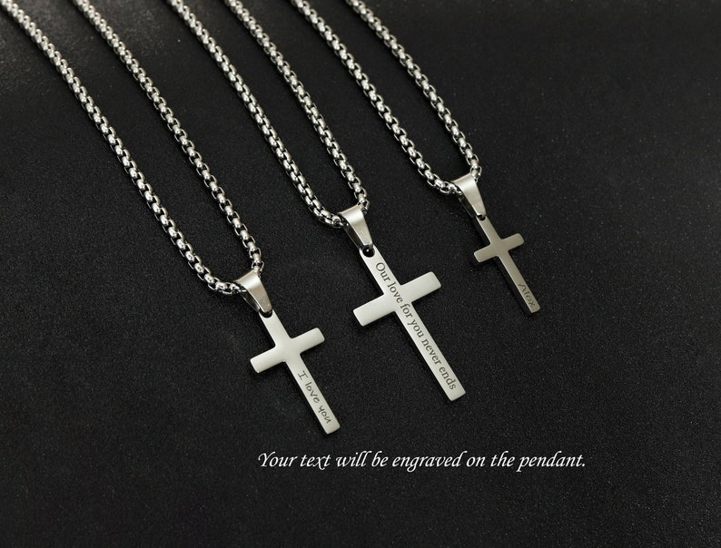 May include: Three silver chain necklaces with cross pendants. Each pendant has a different engraved message: "I love you", "Our love for you never ends", and "Alice".