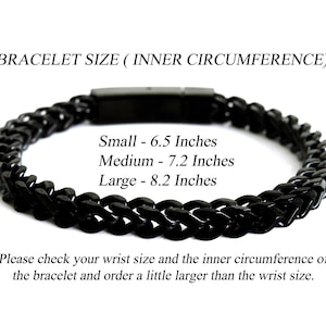 May include: A black chain link bracelet with a rectangular clasp. Text reads: BRACELET SIZE (INNER CIRCUMFERENCE), Small - 6.5 Inches, Medium - 7.2 Inches, Large - 8.2 Inches. Please check your wrist size and the inner circumference of the bracelet.
