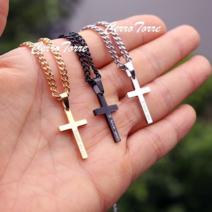 May include: Three silver cross necklaces with different inscriptions. The gold necklace has "Isaiah 41:10" inscribed on the cross, the black necklace has "I love you" inscribed on the cross, and the silver necklace has "I love you" inscribed on the cross.