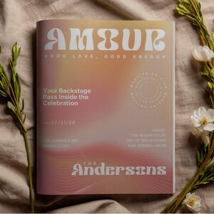May include: A magazine titled "AMBUR" with the tagline "GOOD LOVE, GOOD ENERGY." The cover features a gradient of pink and orange hues. Text includes "Your Backstage Pass Inside the Celebration" and "The Andersons."