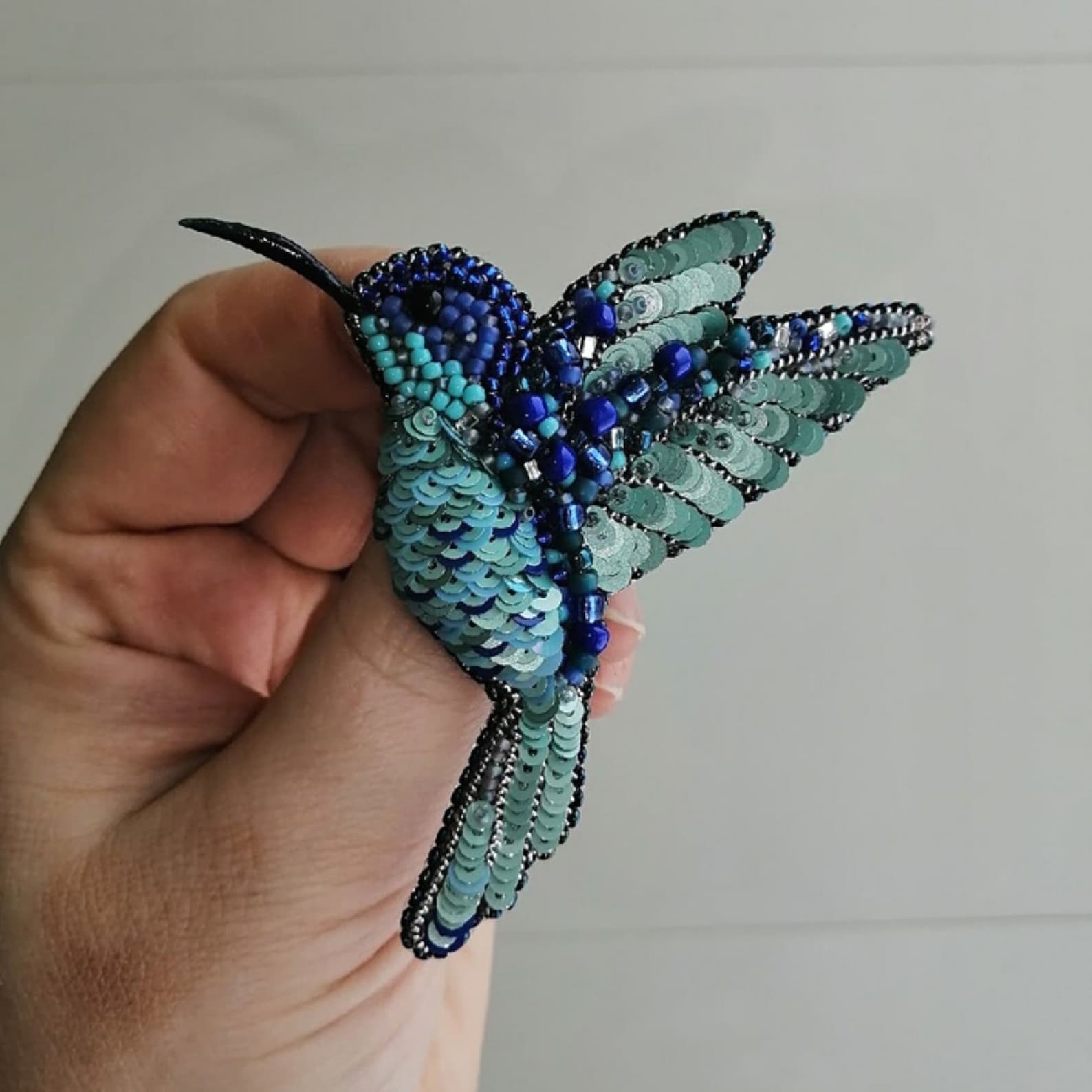 Beaded brooch bird. Brooch made of beads and sequins in the Etsy