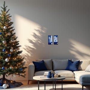 Elegant Christmas living room with indigo blue and white embroidered wall art by ElinaTextileArt, paired with blue ornaments and minimalist design.