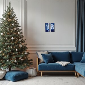 Minimalist living room interior with blue and white embroidered textile artworks by ElinaTextileArt, styled as modern Christmas wall decor.