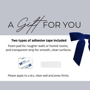Gift information card showing two types of adhesive tape included for hanging textile wall art on smooth or rough surfaces.