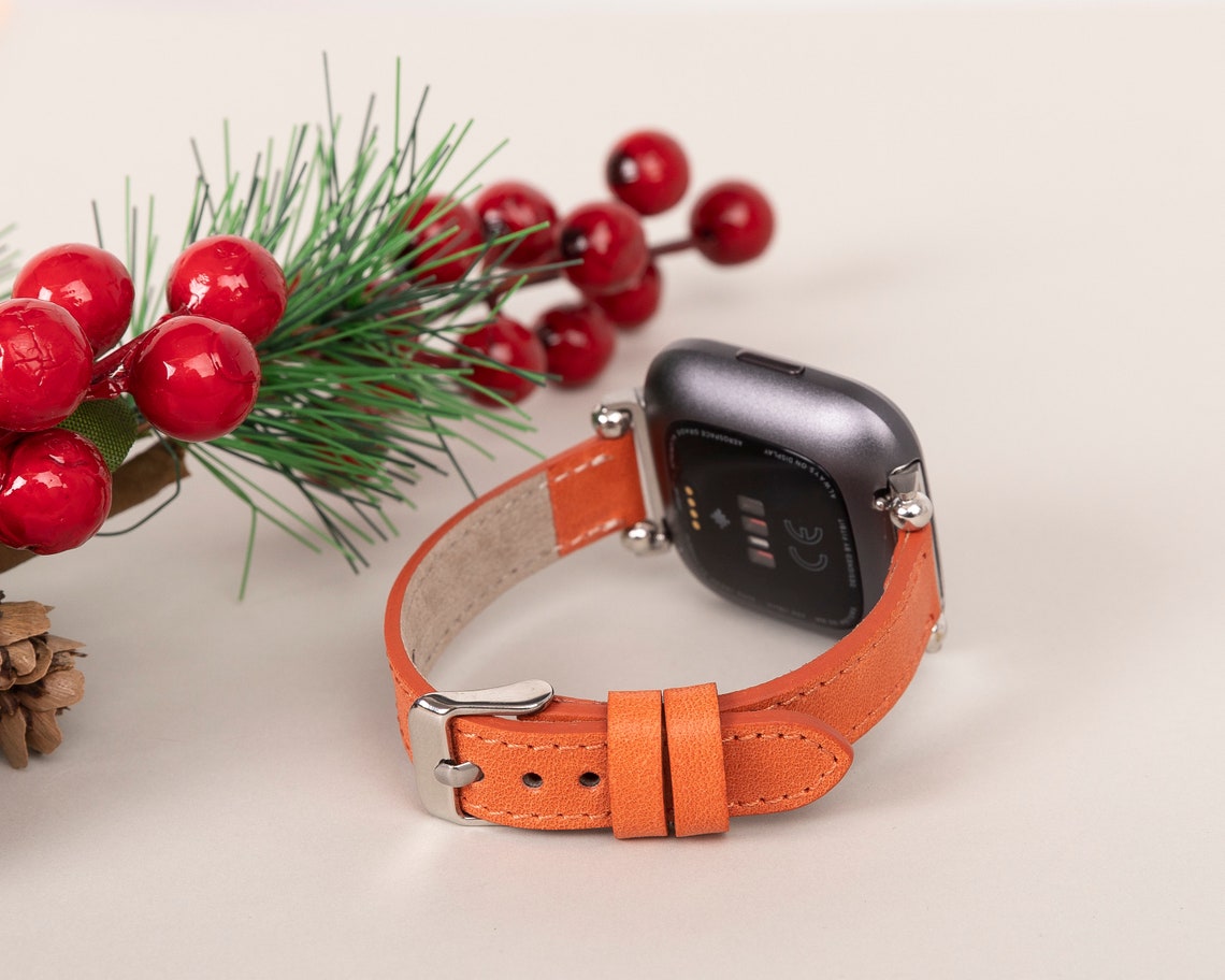 orange fitbit versa band