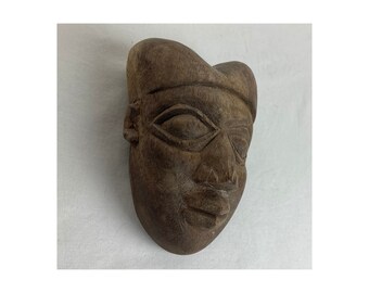 Small hand carved African art mask from Cameroon.