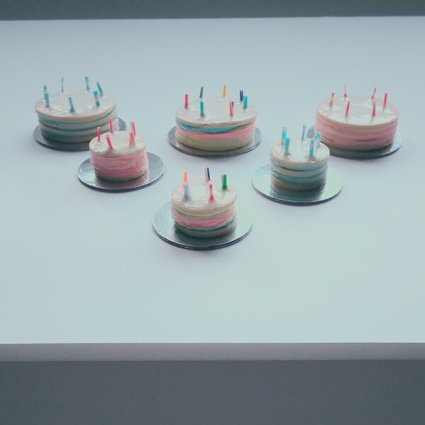 Dolls house miniature birthday cake with candles, 12th and 16th scale.