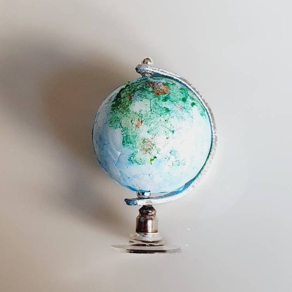 Dolls house miniature rotating globe.