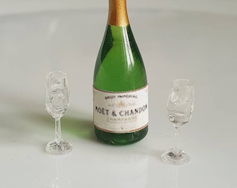 Dolls house miniature champagne bottle and glasses.