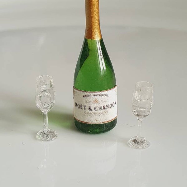 Dolls house miniature champagne bottle and glasses.