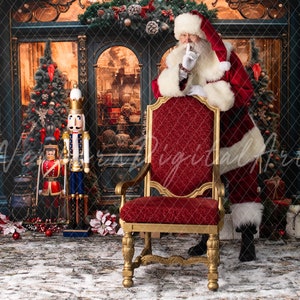 May include: Santa Claus in a red suit with white trim stands behind a red velvet chair with gold accents. He is holding his finger to his lips, as if to say 'shhh'.  A nutcracker stands in the background.