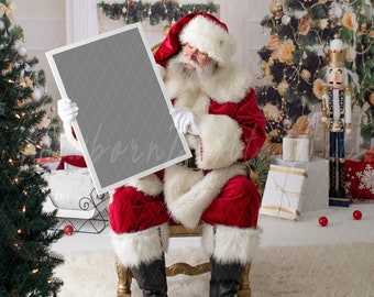 May include: Santa Claus in a red suit and white beard sits on a golden throne holding a blank white frame in front of a Christmas tree and fireplace.