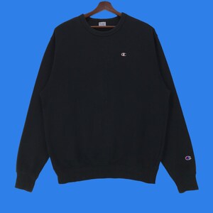 Sudadera vintage de cuello redondo con logotipo pequeño de Champion. Sudadera vintage de talla extragrande con cuello redondo de Champion.