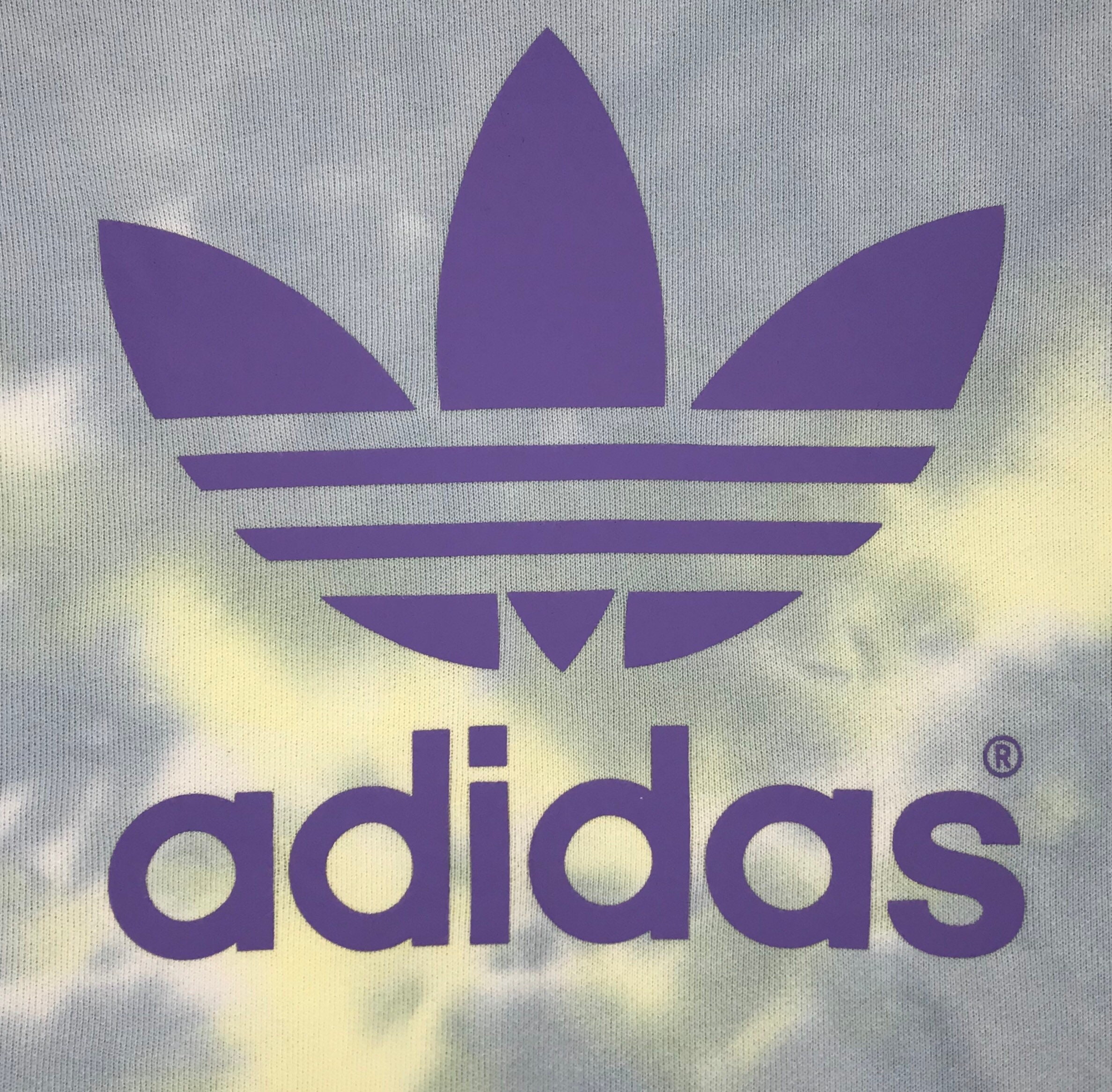 purple adidas logo