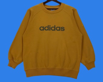 yellow adidas hoodie with black stripes