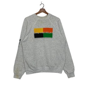 May include: Gray sweatshirt with a colorful graphic on the front that says "Civil War Relay 50 Mile Team Relay - November 21-1983".