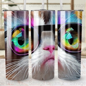 May include: A white cat with brown markings wearing colorful sunglasses. The cat's eyes are visible through the sunglasses. The image is a close-up of the cat's face.