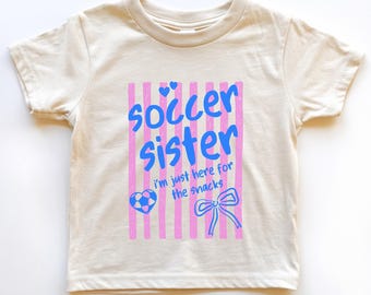 T-shirt pour les petites filles et le bébé du football, ici pour le goûter Tenues pour la soeur d'un joueur de football