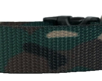 May include: A green, brown, and tan camouflage dog collar with a silver metal buckle.