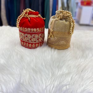Designer Bridal Potli Bag for women with Embroidery and Embellished Stones