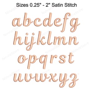 May include: A set of uppercase letters in a cursive font, embroidered in a light brown satin stitch. The letters are arranged in three rows, with the first row being a, b, c, d, e, f, and g. The second row is h, i, j, k, l, m, and n. The third row is o, p, q, r, s, t, u, v, w, x, y, and z. The letters are all approximately the same size and are spaced evenly apart.