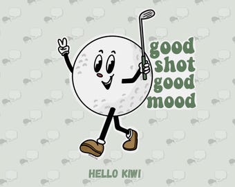 May include: A cartoon golf ball character with a golf club, giving a peace sign. The text reads "good shot good mood" in green. The background is light green with kiwi and speech bubble patterns. The text "HELLO KIWI" is at the bottom.