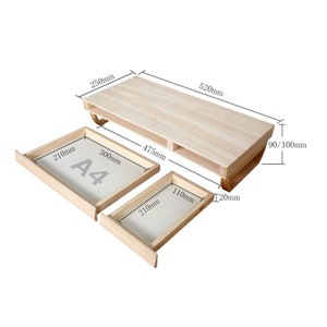 May include: A wooden shelf unit with two drawers. The shelf is 520mm long, 250mm wide, and 90mm high. The drawers are 210mm wide and 300mm long. The shelf has a label that says "A4".