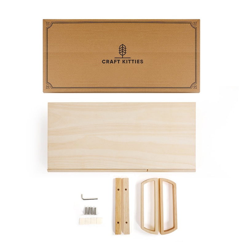 May include: A flat-pack wooden shelf kit with two shelves, two handles, and hardware for assembly. The box is brown with the logo "CRAFT KITTIES" printed on it.