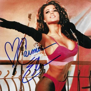 carmen electra sexy lingerie Carmen Electra, 51, rocks just red satin lingerie as she licks a candy cane  with Sopranos pal Drea de Matteo