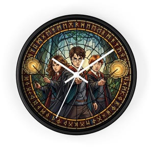 May include: A round black wall clock featuring a stained-glass style design with three figures holding wands. The clock face has a forest background and a border with runes. The clock hands are white.
