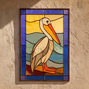 May include: Stained glass panel depicting a pelican. The artwork shows the bird with an orange beak, set against a backdrop of stylized waves and a sunset. The frame is a dark brown colour.