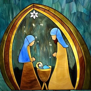 May include: Stained glass image of the Nativity. Mary and Joseph, in blue and gold robes, look at baby Jesus in a manger. A white star is above the scene, set against a teal and gold background.