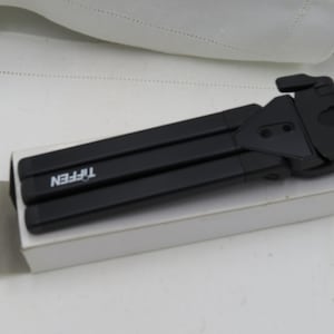 Tiffen flat folding tripod - new in box