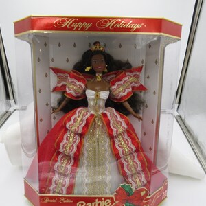 Barbie Happy Holidays 10th Anniversary -  - NIB Wrapped in red ribbons and delicate lace, Barbie is a portrait of holiday grace!