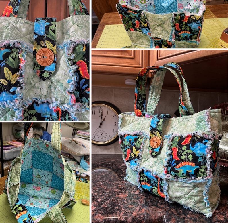 Puede incluir: Una bolsa de mano de lona verde y negra con tejido de dinosaurio. La bolsa tiene un cierre de solapa con un bot&oacute;n y dos asas.