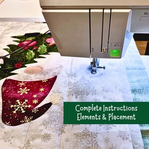 May include: A close-up of a sewing machine stitching a quilt with a Christmas theme. The quilt features a red and white Santa hat with snowflakes, a green holly sprig, and a white background with snowflakes. The text "Complete Instructions Elements & Placement" is visible in the image.