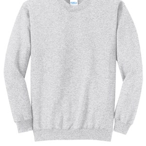 May include: A heather gray sweatshirt with long sleeves and a crew neck. The sweatshirt has a small tag on the front that says "Port & Company".