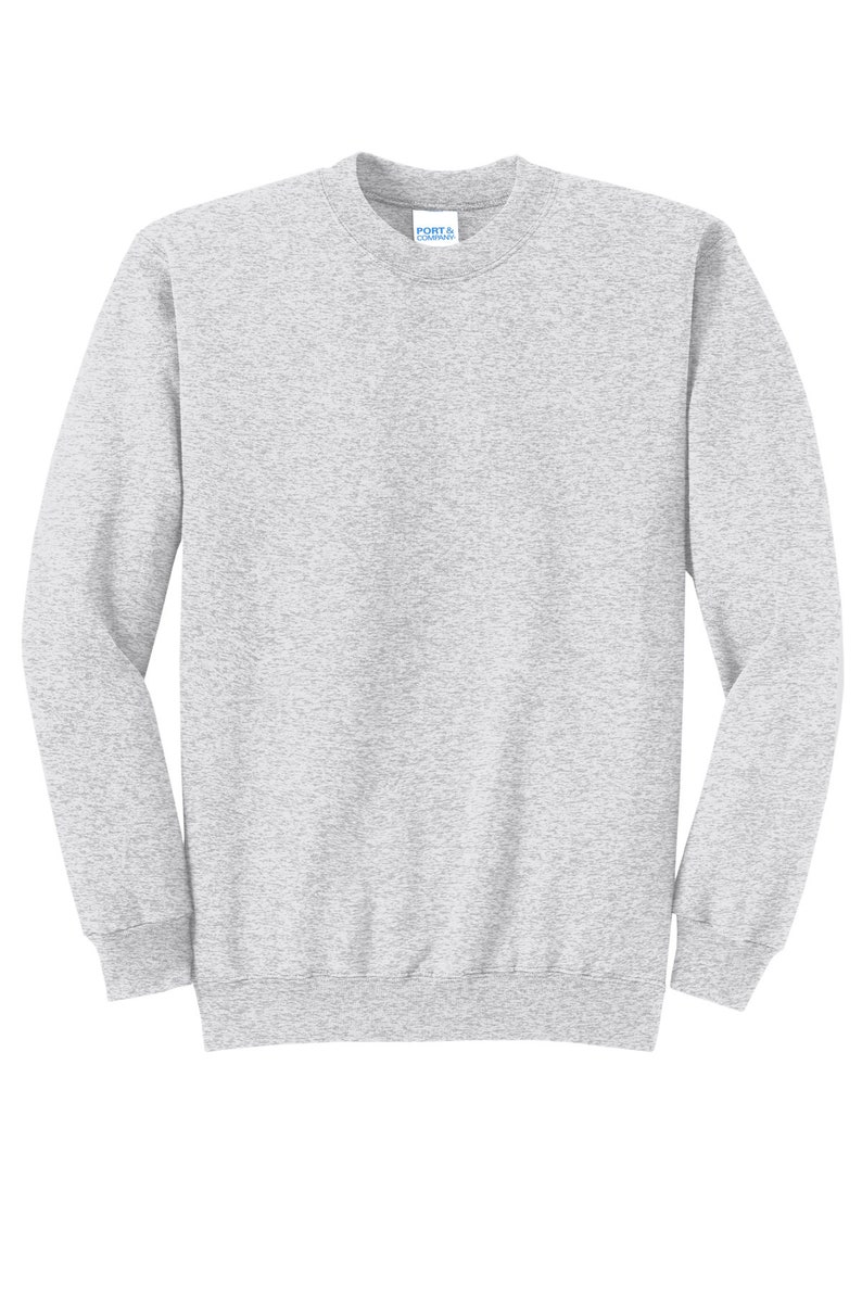 May include: A heather gray sweatshirt with long sleeves and a crew neck. The sweatshirt has a small tag on the front that says "Port & Company".