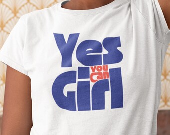 May include: White t-shirt with a blue and red graphic that says "Yes You Can Girl".