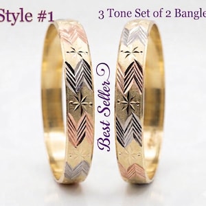 May include: Two gold bangles with a three-tone design featuring chevron and star patterns. The bangles have rose gold, silver, and gold accents. The text "Style #1" and "3 Tone Set of 2 Bangles" are visible.