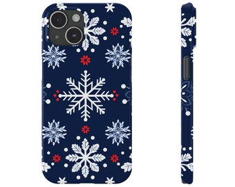 May include: A navy blue phone case with a white snowflake pattern and red dots.