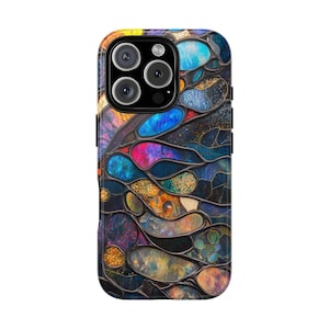 May include: A colorful phone case with a stained glass design featuring a variety of colors, including blue, purple, red, and gold. The case has a black border and a camera cutout.